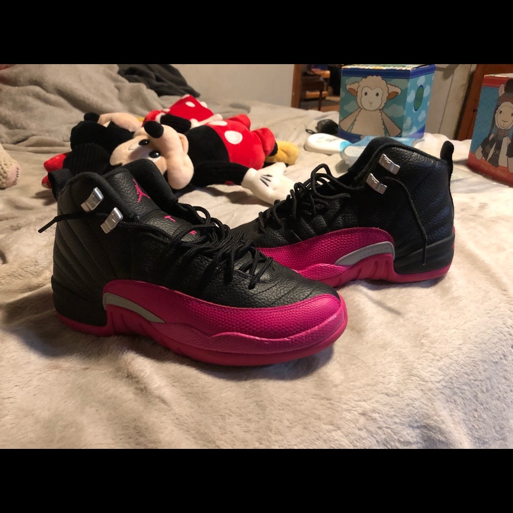 Pink and black Jordan 12s